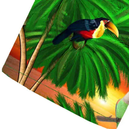 Nahaufnahme: farbenfroher Vogel- und Dschungel-Print auf grüner Hemdstoffoberfläche